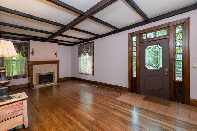 entryway featuring coffered ceiling, beam ceiling, and dark hardwood / wood-style floors