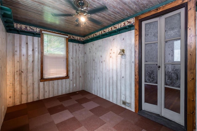 spare room featuring ceiling fan and wooden ceiling