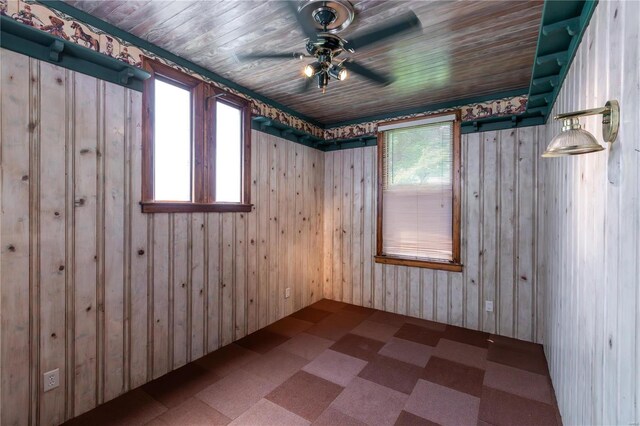 spare room featuring wood ceiling and ceiling fan