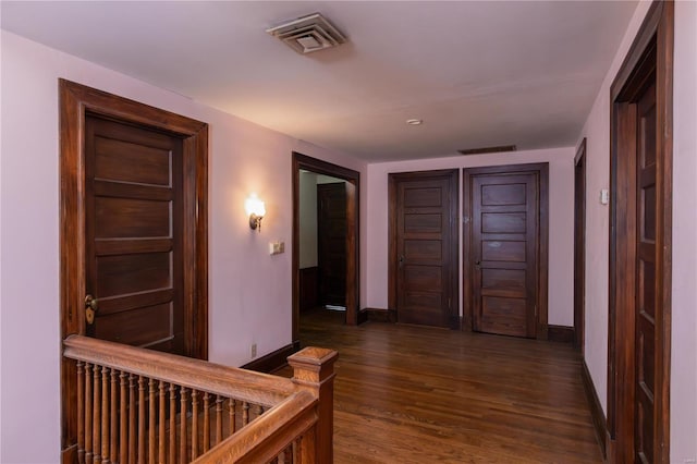 hallway featuring dark wood-type flooring