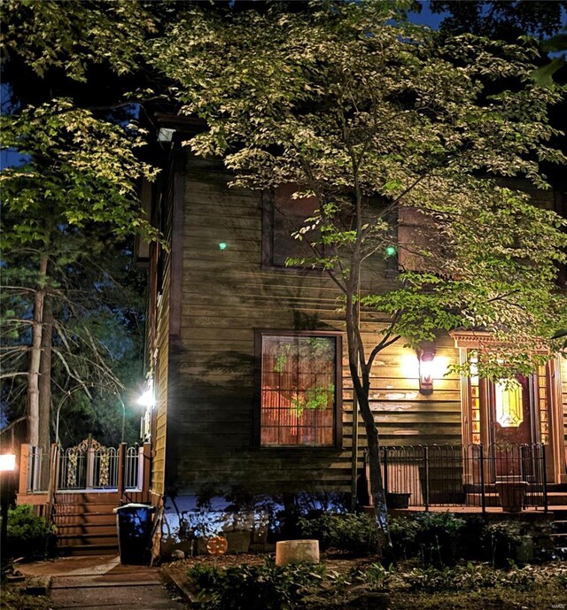 view of property exterior at night