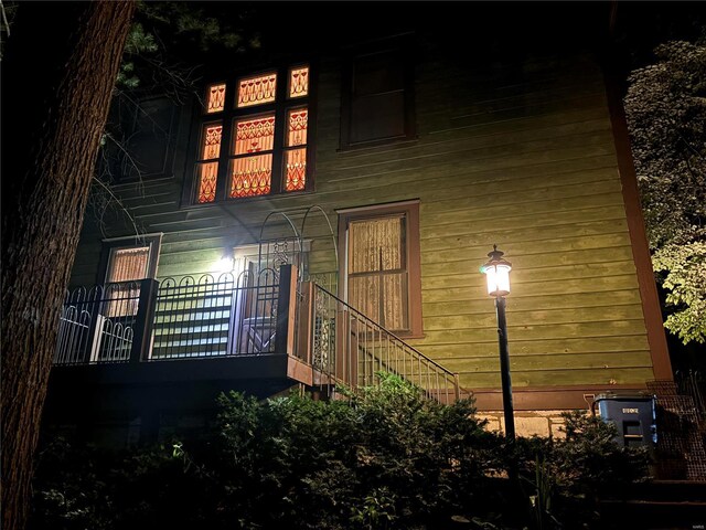 view of property exterior at night