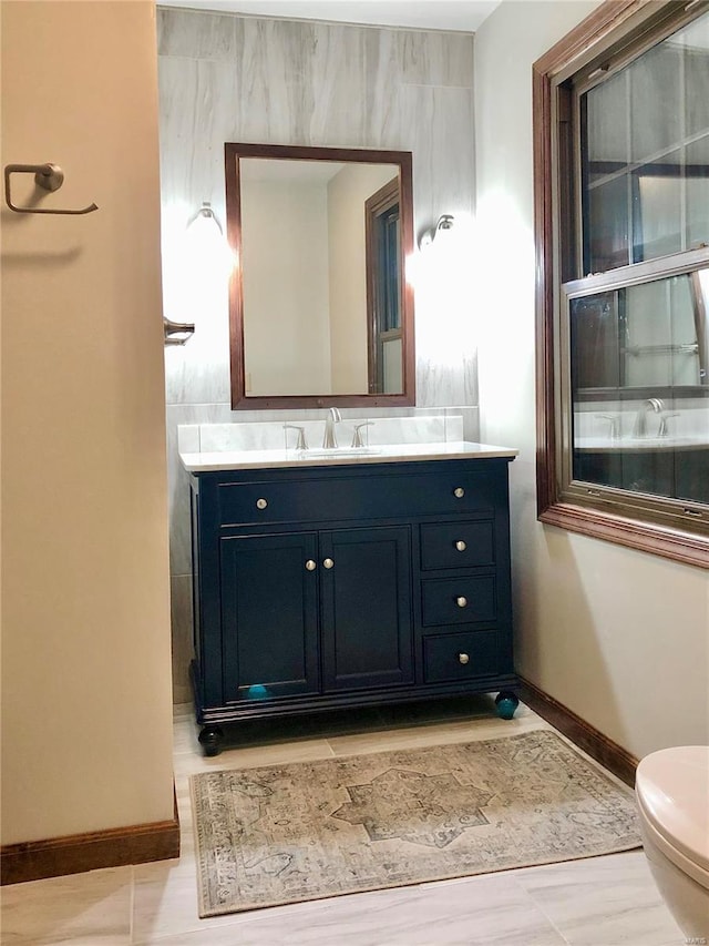 bathroom with vanity and toilet