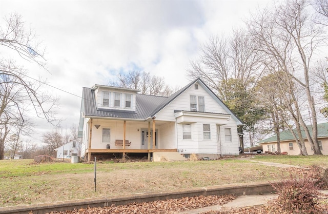 back of property featuring a yard and a porch