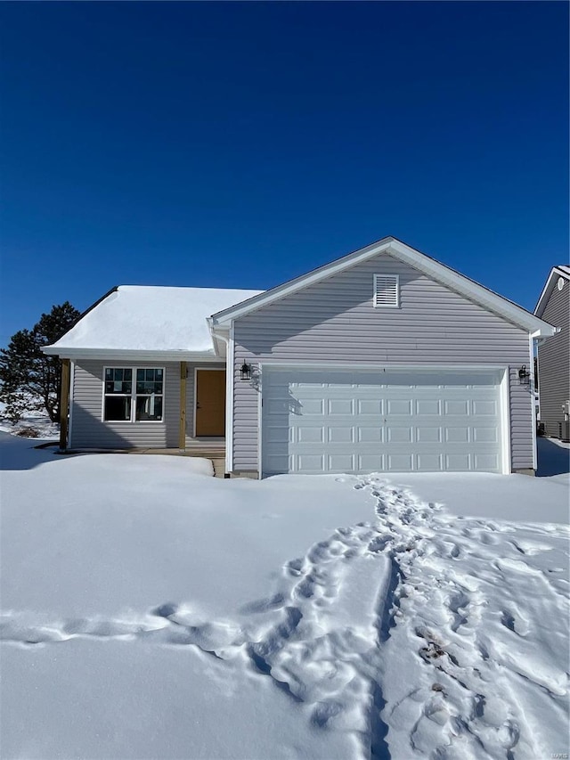 single story home featuring a garage