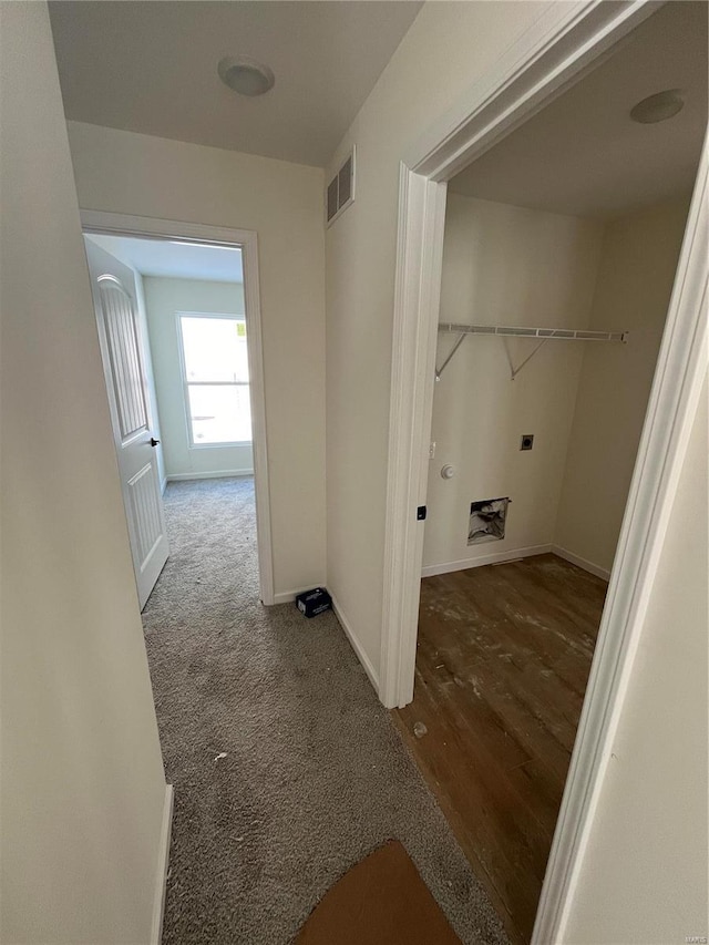 clothes washing area featuring carpet flooring and electric dryer hookup