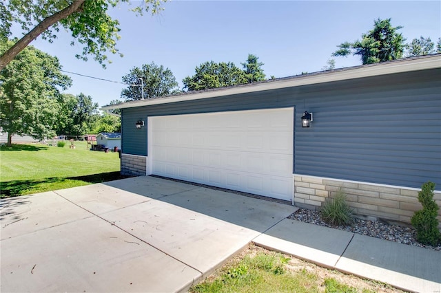 garage with a lawn