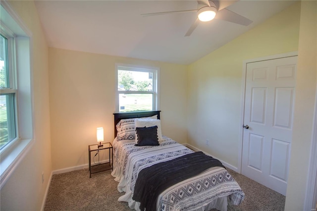 carpeted bedroom featuring vaulted ceiling and ceiling fan