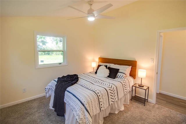 carpeted bedroom featuring ceiling fan and lofted ceiling