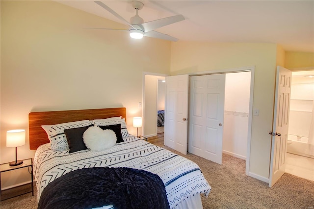 bedroom with carpet flooring, ceiling fan, a closet, and lofted ceiling