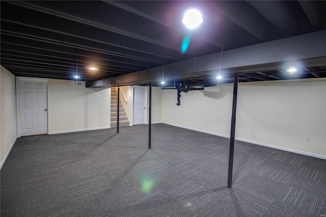 basement with dark carpet