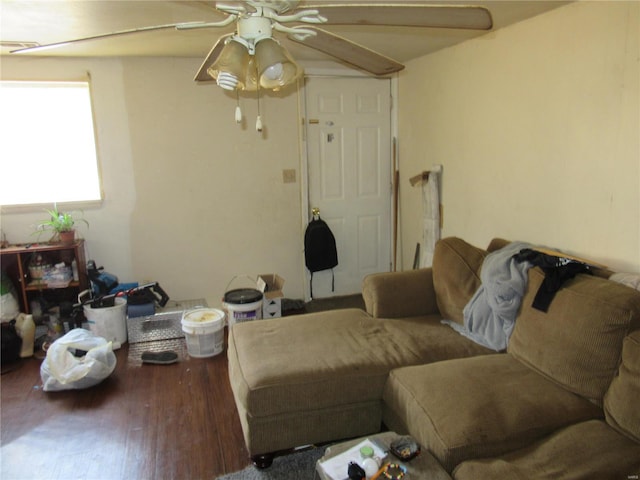 living room featuring ceiling fan and hardwood / wood-style floors