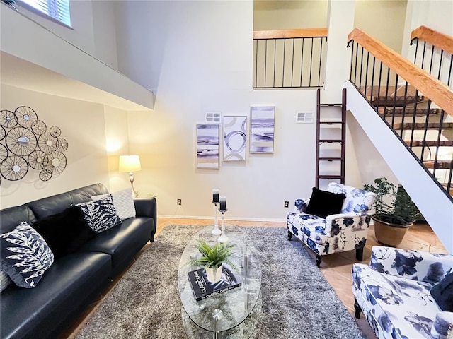 living room with a towering ceiling