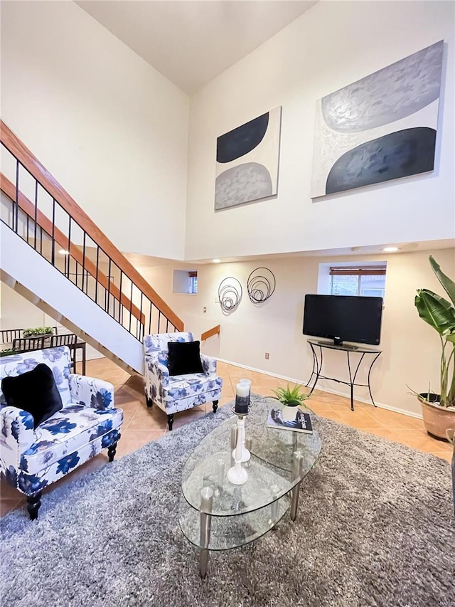 living room with a high ceiling