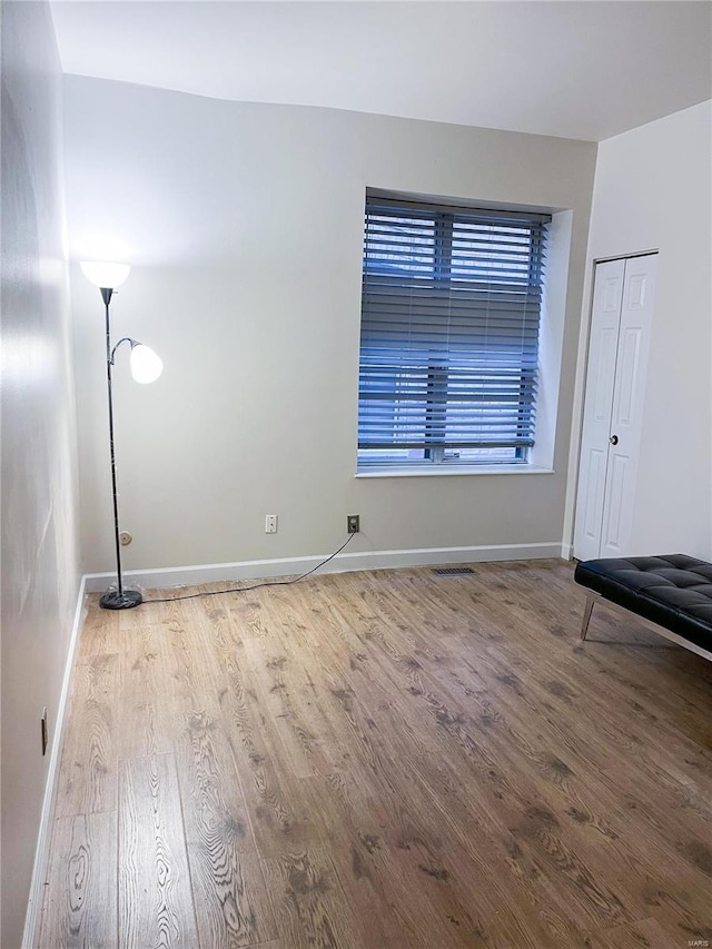 empty room featuring hardwood / wood-style flooring