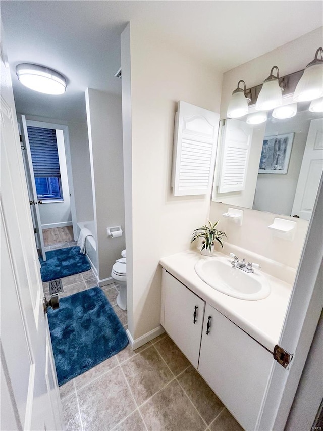 full bathroom featuring bathtub / shower combination, vanity, tile patterned flooring, and toilet