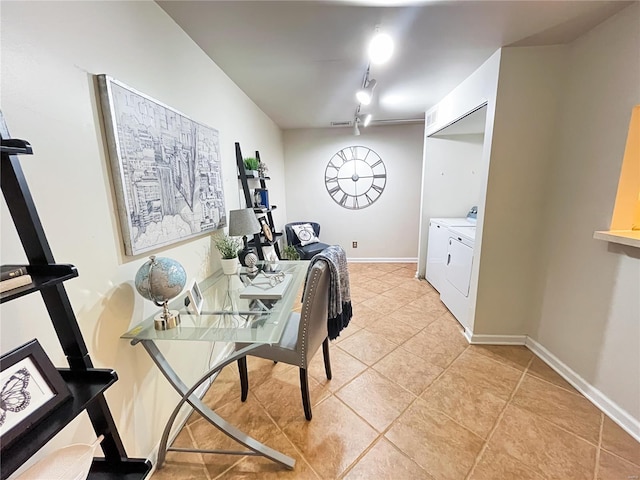 interior space featuring light tile patterned floors and washing machine and clothes dryer