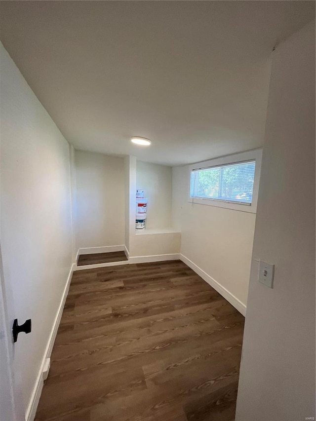 unfurnished room with dark hardwood / wood-style floors