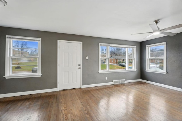 entryway with ceiling fan and hardwood / wood-style flooring