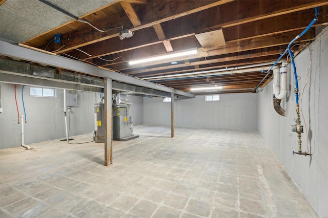 basement with water heater and heating unit