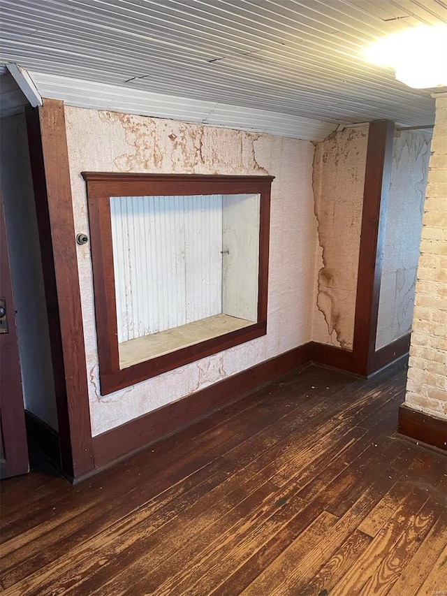 unfurnished room featuring dark hardwood / wood-style flooring