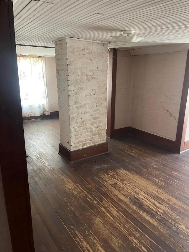 empty room with dark wood-type flooring