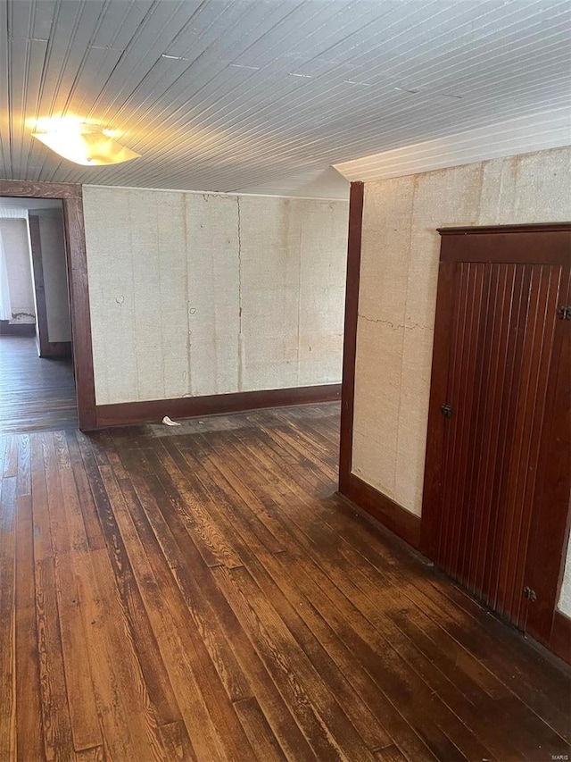 unfurnished room featuring dark hardwood / wood-style flooring