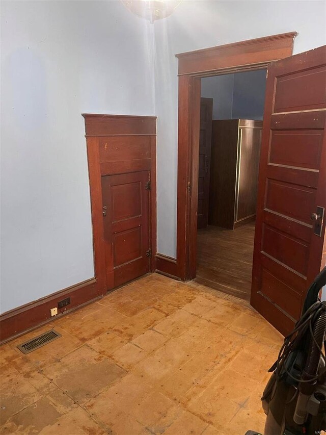 hallway with light hardwood / wood-style flooring