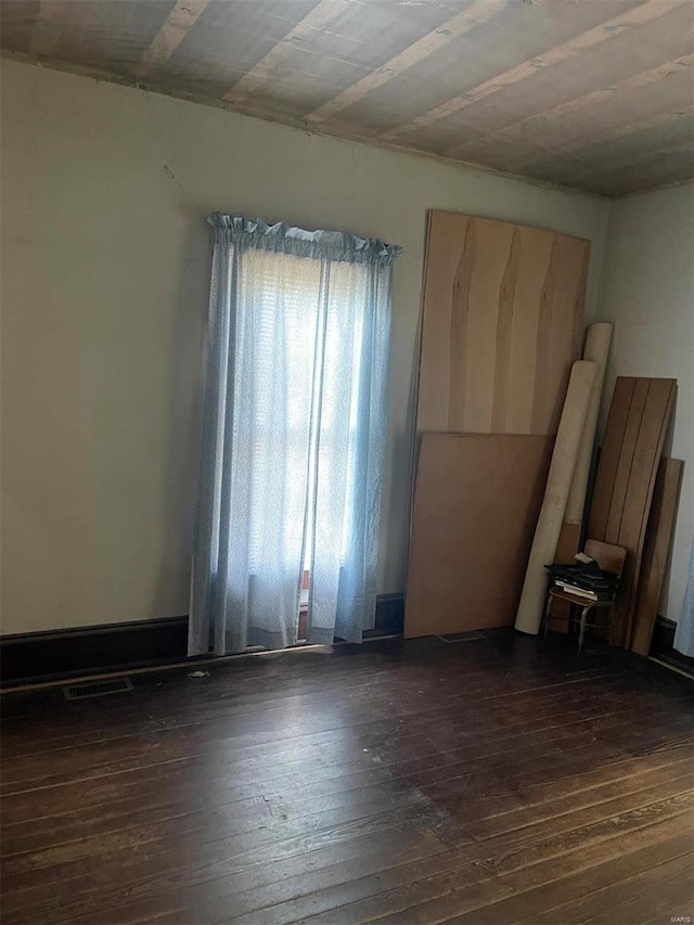 empty room featuring dark hardwood / wood-style floors