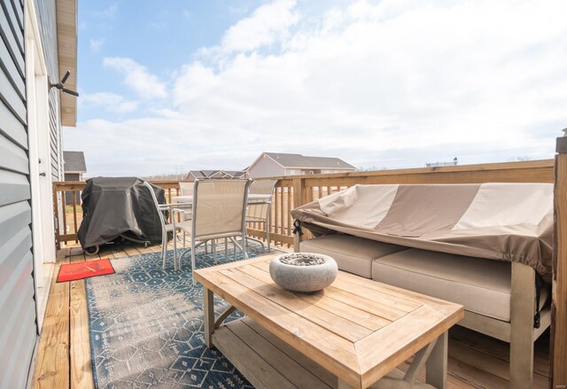 wooden terrace featuring area for grilling