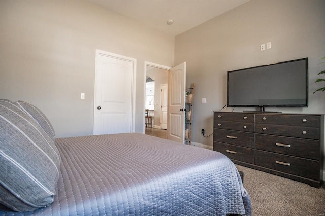 bedroom with baseboards and carpet flooring