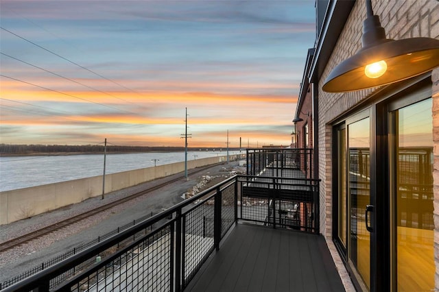 balcony at dusk with a water view