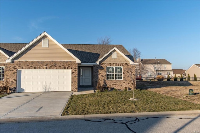 view of front of house with a front lawn and a garage