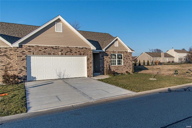 view of front of property featuring a garage and a front lawn