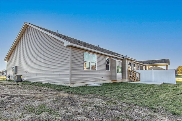 back of house featuring a yard and a patio