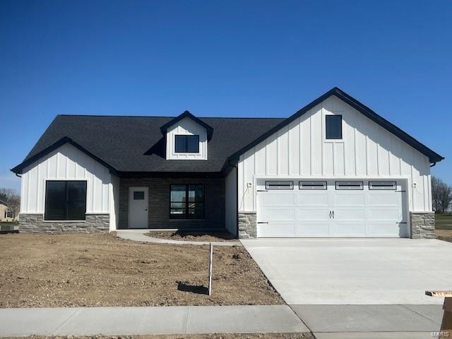 modern farmhouse style home with a garage