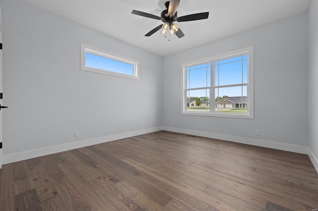 empty room with wood-type flooring and ceiling fan