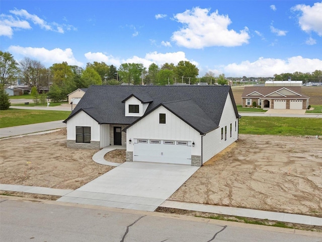 modern farmhouse featuring a garage