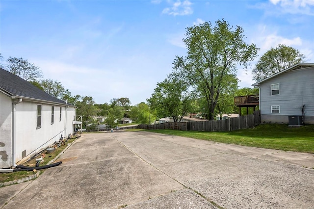 view of parking / parking lot with a yard