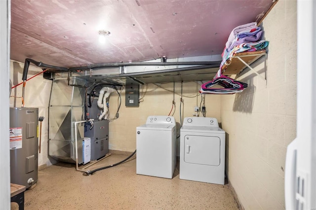 clothes washing area with water heater and washer and dryer