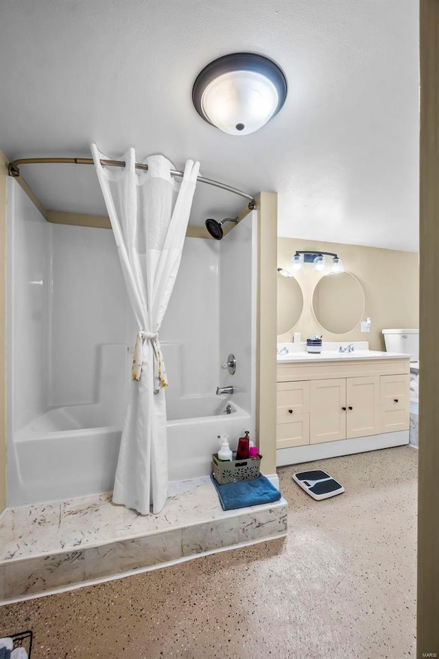 bathroom featuring washtub / shower combination and vanity