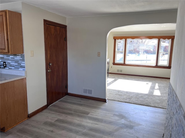 interior space featuring light colored carpet