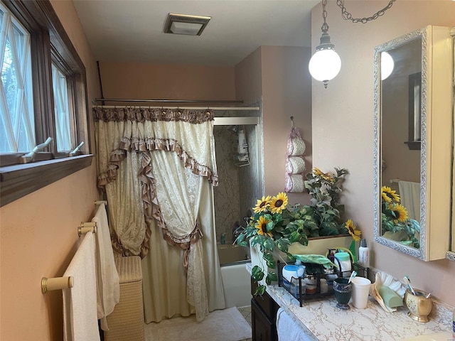 bathroom with shower / tub combo with curtain