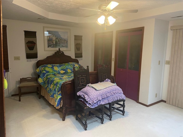 bedroom featuring ceiling fan and light colored carpet