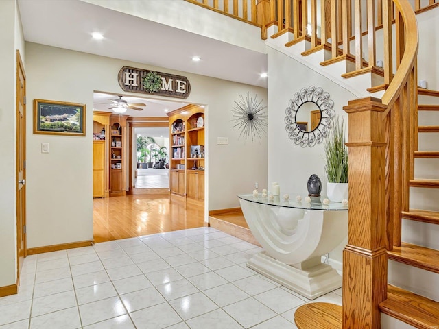 interior space with ceiling fan