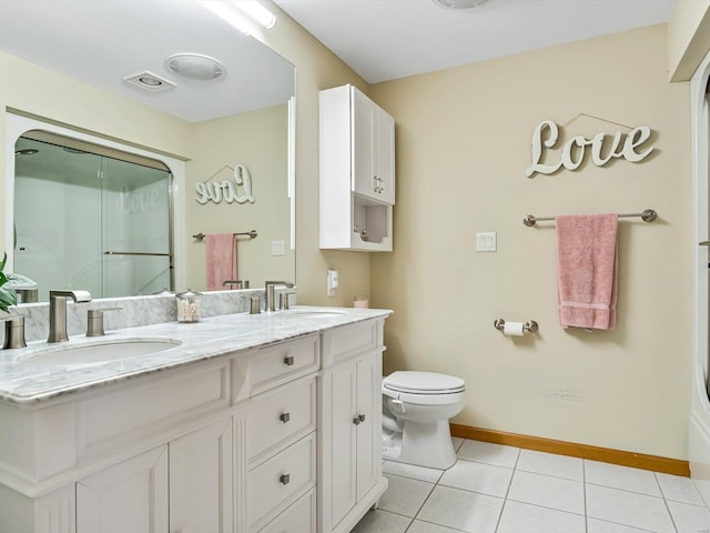 bathroom with tile patterned floors, toilet, and vanity