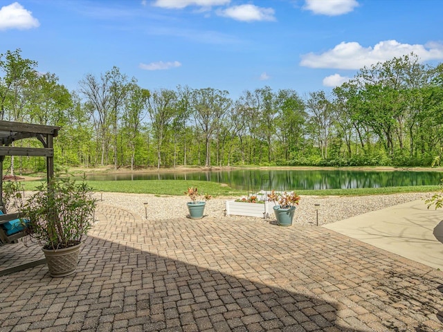 view of patio with a water view