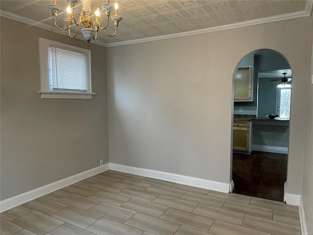 unfurnished room featuring ceiling fan with notable chandelier and ornamental molding