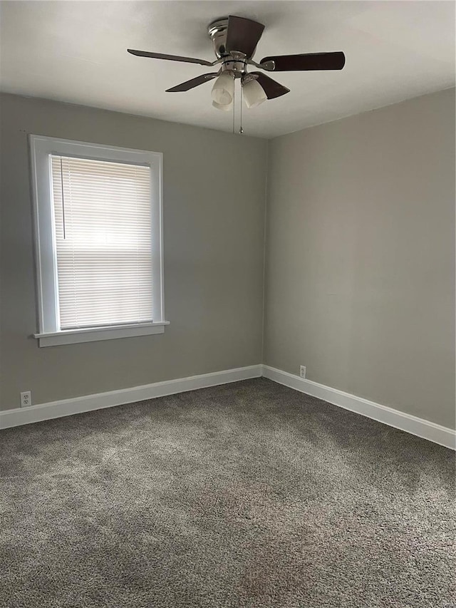 carpeted empty room with ceiling fan