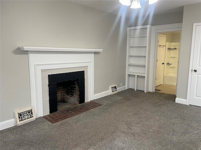 unfurnished living room featuring carpet floors